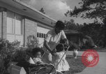 Image of African American suburban mother with children Atlanta Georgia USA, 1960, second 38 stock footage video 65675079731