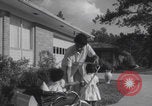 Image of African American suburban mother with children Atlanta Georgia USA, 1960, second 39 stock footage video 65675079731