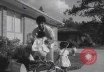 Image of African American suburban mother with children Atlanta Georgia USA, 1960, second 41 stock footage video 65675079731
