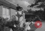 Image of African American suburban mother with children Atlanta Georgia USA, 1960, second 43 stock footage video 65675079731