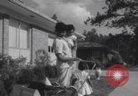Image of African American suburban mother with children Atlanta Georgia USA, 1960, second 44 stock footage video 65675079731