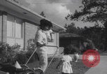Image of African American suburban mother with children Atlanta Georgia USA, 1960, second 46 stock footage video 65675079731