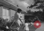 Image of African American suburban mother with children Atlanta Georgia USA, 1960, second 47 stock footage video 65675079731