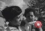Image of African American suburban mother with children Atlanta Georgia USA, 1960, second 59 stock footage video 65675079731