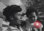 Image of African American suburban mother with children Atlanta Georgia USA, 1960, second 62 stock footage video 65675079731