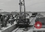 Image of  military equipment unloaded Iran Iran, 1960, second 22 stock footage video 65675079806