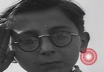Image of Boys salute 101st Airborne Mourmelon le Grand France, 1945, second 13 stock footage video 65675080001