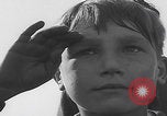 Image of Boys salute 101st Airborne Mourmelon le Grand France, 1945, second 17 stock footage video 65675080001