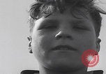 Image of Boys salute 101st Airborne Mourmelon le Grand France, 1945, second 20 stock footage video 65675080001