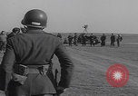 Image of Boys salute 101st Airborne Mourmelon le Grand France, 1945, second 55 stock footage video 65675080001