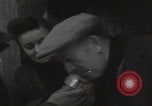 Image of 347th Regiment Troops give cigarette Saint Hubert Belgium, 1945, second 17 stock footage video 65675080015