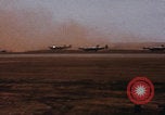 Image of Consolidated B-24 bombers take off Libya, 1943, second 23 stock footage video 65675080136