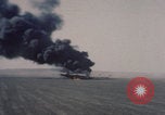Image of Consolidated B-24 Liberator bomber burning Berca Airfield Benghazi Libya, 1943, second 12 stock footage video 65675080140
