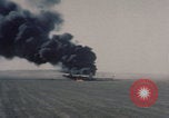 Image of Consolidated B-24 Liberator bomber burning Berca Airfield Benghazi Libya, 1943, second 13 stock footage video 65675080140