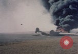 Image of Consolidated B-24 Liberator bomber burning Berca Airfield Benghazi Libya, 1943, second 15 stock footage video 65675080140