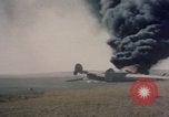 Image of Consolidated B-24 Liberator bomber burning Berca Airfield Benghazi Libya, 1943, second 16 stock footage video 65675080140