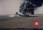 Image of Consolidated B-24 Liberator bomber burning Berca Airfield Benghazi Libya, 1943, second 21 stock footage video 65675080140
