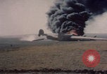 Image of Consolidated B-24 Liberator bomber burning Berca Airfield Benghazi Libya, 1943, second 22 stock footage video 65675080140