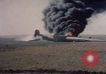 Image of Consolidated B-24 Liberator bomber burning Berca Airfield Benghazi Libya, 1943, second 23 stock footage video 65675080140