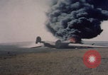 Image of Consolidated B-24 Liberator bomber burning Berca Airfield Benghazi Libya, 1943, second 25 stock footage video 65675080140