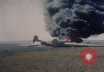 Image of Consolidated B-24 Liberator bomber burning Berca Airfield Benghazi Libya, 1943, second 27 stock footage video 65675080140