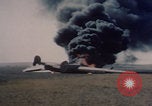 Image of Consolidated B-24 Liberator bomber burning Berca Airfield Benghazi Libya, 1943, second 28 stock footage video 65675080140