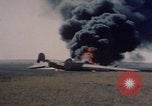 Image of Consolidated B-24 Liberator bomber burning Berca Airfield Benghazi Libya, 1943, second 29 stock footage video 65675080140