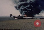 Image of Consolidated B-24 Liberator bomber burning Berca Airfield Benghazi Libya, 1943, second 32 stock footage video 65675080140