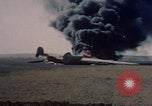 Image of Consolidated B-24 Liberator bomber burning Berca Airfield Benghazi Libya, 1943, second 33 stock footage video 65675080140