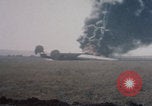 Image of Consolidated B-24 Liberator bomber burning Berca Airfield Benghazi Libya, 1943, second 50 stock footage video 65675080140