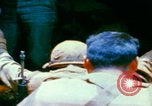 Image of US Army doctors treating leg Vietnam, 1967, second 43 stock footage video 65675080307