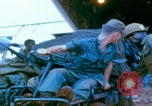 Image of US Army doctors treating leg Vietnam, 1967, second 50 stock footage video 65675080307