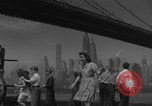 Image of children playing under Brooklyn Bridge New York City USA, 1944, second 3 stock footage video 65675080373