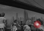 Image of children playing under Brooklyn Bridge New York City USA, 1944, second 6 stock footage video 65675080373