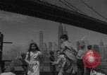 Image of children playing under Brooklyn Bridge New York City USA, 1944, second 7 stock footage video 65675080373