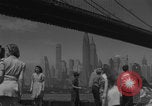 Image of children playing under Brooklyn Bridge New York City USA, 1944, second 11 stock footage video 65675080373