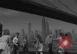 Image of children playing under Brooklyn Bridge New York City USA, 1944, second 12 stock footage video 65675080373