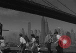 Image of children playing under Brooklyn Bridge New York City USA, 1944, second 13 stock footage video 65675080373