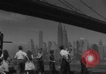 Image of children playing under Brooklyn Bridge New York City USA, 1944, second 14 stock footage video 65675080373