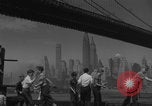 Image of children playing under Brooklyn Bridge New York City USA, 1944, second 15 stock footage video 65675080373