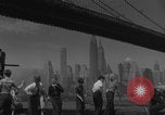 Image of children playing under Brooklyn Bridge New York City USA, 1944, second 16 stock footage video 65675080373