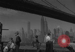 Image of children playing under Brooklyn Bridge New York City USA, 1944, second 18 stock footage video 65675080373