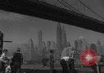 Image of children playing under Brooklyn Bridge New York City USA, 1944, second 19 stock footage video 65675080373
