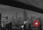 Image of children playing under Brooklyn Bridge New York City USA, 1944, second 21 stock footage video 65675080373