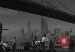 Image of children playing under Brooklyn Bridge New York City USA, 1944, second 22 stock footage video 65675080373