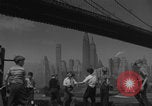 Image of children playing under Brooklyn Bridge New York City USA, 1944, second 24 stock footage video 65675080373