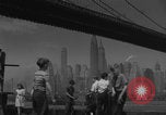 Image of children playing under Brooklyn Bridge New York City USA, 1944, second 26 stock footage video 65675080373
