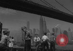 Image of children playing under Brooklyn Bridge New York City USA, 1944, second 27 stock footage video 65675080373