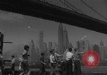 Image of children playing under Brooklyn Bridge New York City USA, 1944, second 28 stock footage video 65675080373