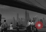 Image of children playing under Brooklyn Bridge New York City USA, 1944, second 30 stock footage video 65675080373